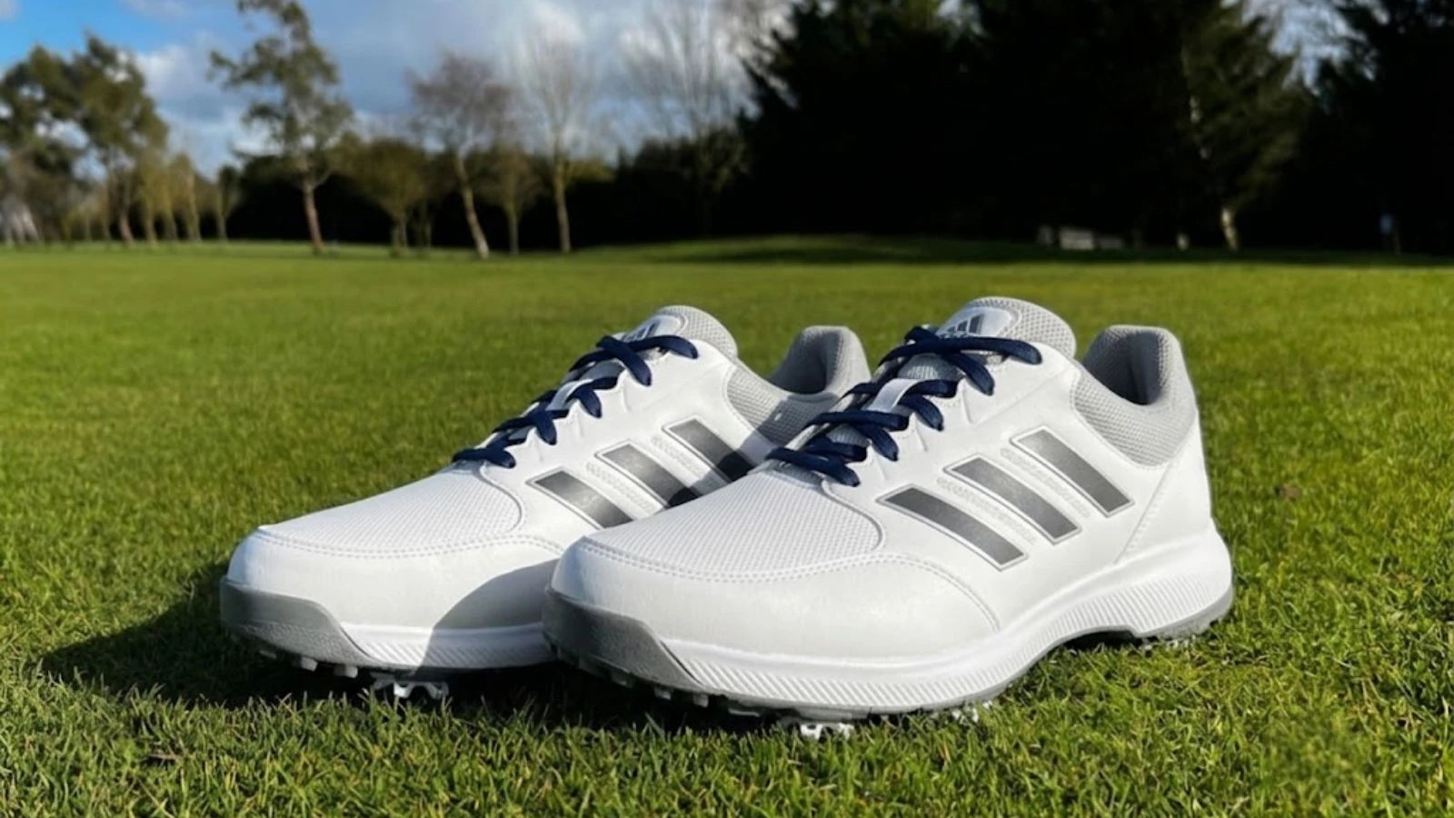 White Adidas Tech Response golf shoes